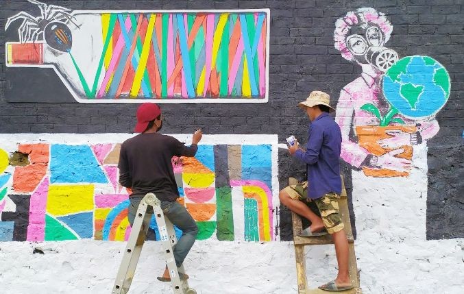 Three artists from Chizami painted mural arts at the Chizami welcome gate, local ground, and the administrative office. (Photo Courtesy: Chizami Students' Union)